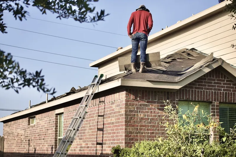Professional roofer working on a residential roof in Arcadia at Inverness Glen